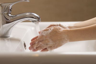 Midsection of woman in bathroom