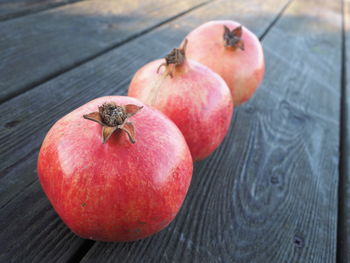 Close-up of pomegranates on wooden table