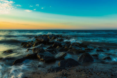 Scenic view of sea against sky during sunset
