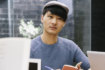 Close-up of man using mobile phone