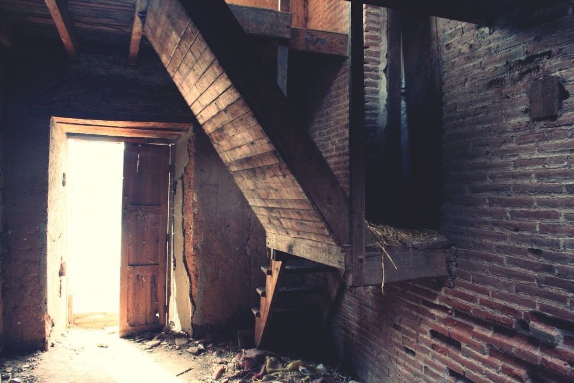 architecture, built structure, abandoned, old, damaged, building exterior, obsolete, deterioration, run-down, weathered, building, indoors, wood - material, house, wall - building feature, sunlight, day, bad condition, architectural column, wall