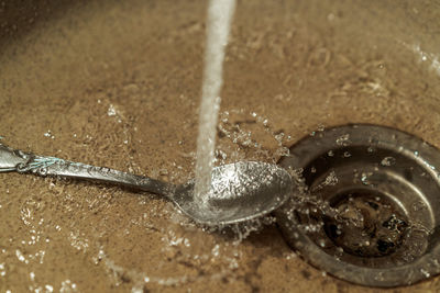 Close-up of water drops on metal