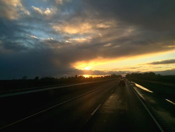 View of road against cloudy sky