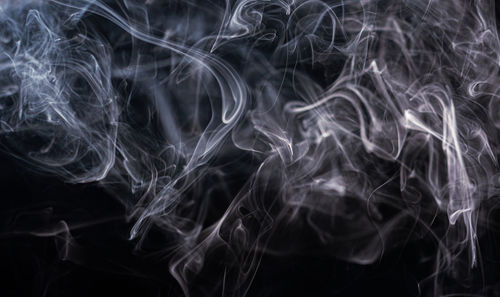 Close-up of smoke against black background