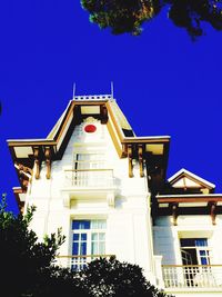 Low angle view of building against blue sky