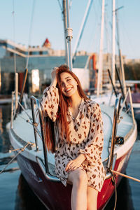 Portrait of a smiling young woman in boat