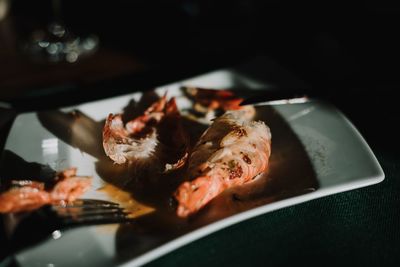 High angle view of fish in plate on table