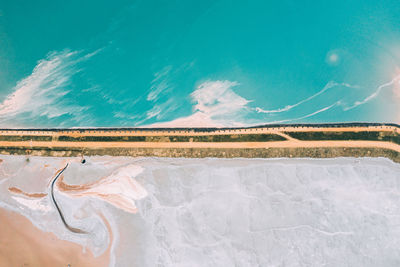 Artificial turquoise lake near the city of soligorsk.production of fertilizers for the land.