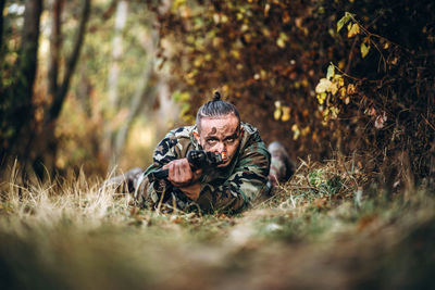 Portrait of soldier in forest