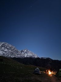 Tent on field against sky at night