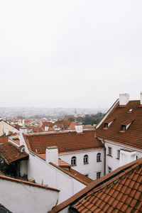 Houses in city against sky