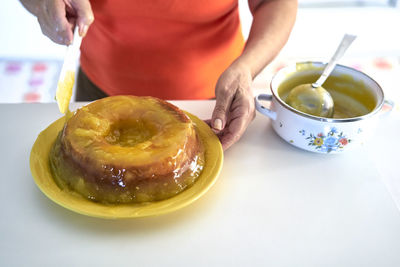 Close-up of woman preparing dessert