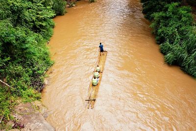 High angle view of men rafting in river