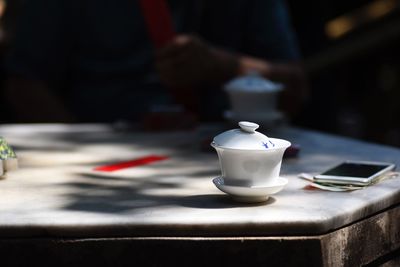 Close-up of coffee cup on table