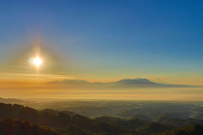 Scenic view of landscape against sky during sunset