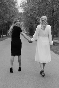 Rear view of women walking in park