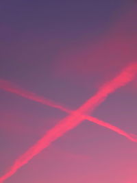 Low angle view of vapor trails in sky