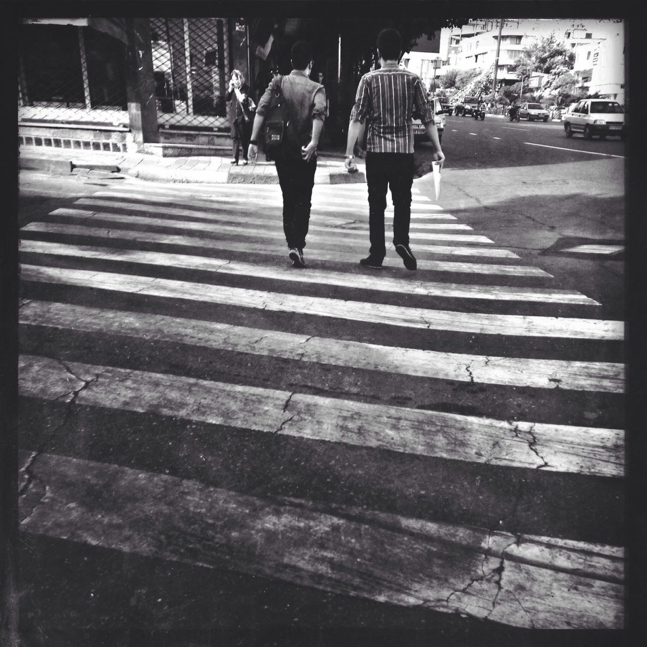 transfer print, walking, lifestyles, auto post production filter, person, men, rear view, full length, leisure activity, city life, street, sunlight, city, sidewalk, steps, shadow, day