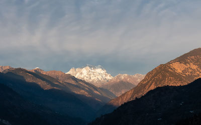 Scenic view of snowcapped mountains against sky