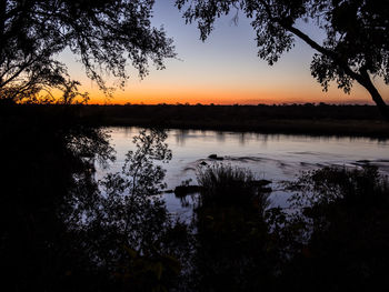 Scenic view of lake during sunset