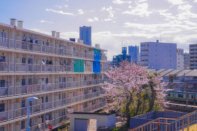 Modern buildings in city against sky