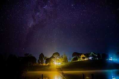 Scenic view of illuminated star field against sky at night