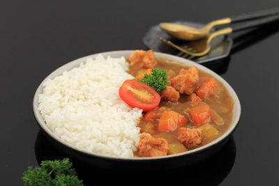 Japanese curry with chicken popcorn, served with white rice. isolated 