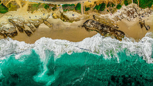 High angle view of rocks in sea