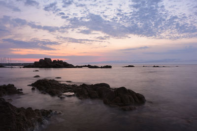 Scenic view of sea against sky at sunset