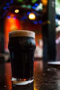 Close-up of beer glass on table