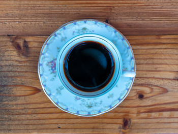 High angle view of black coffee on table