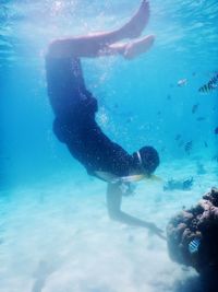 Woman swimming in sea