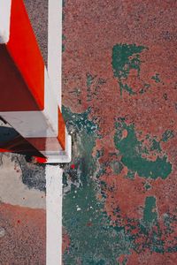 Old soccer goal in the red field on the street