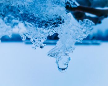 Close-up of snow against blue background