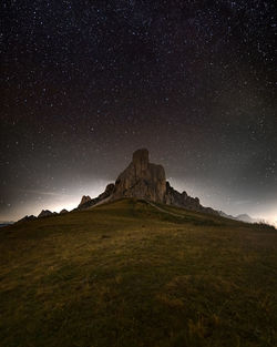 Scenic view of landscape against sky at night