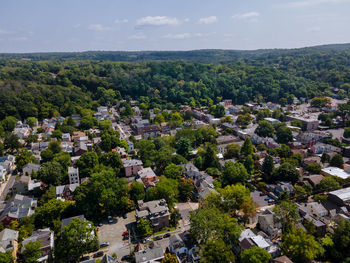 High angle view of trees and buildings against sky