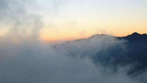 Scenic view of mountains against sky during sunset