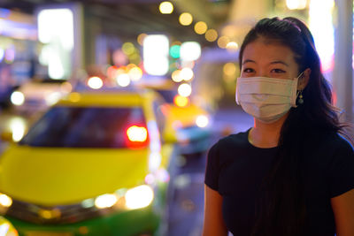 Portrait of a teenage girl standing outdoors