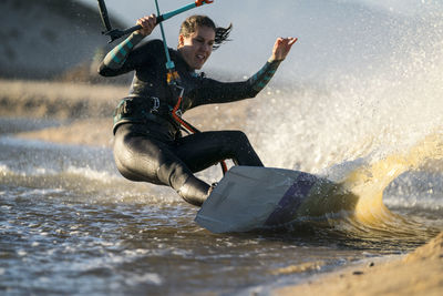 Man splashing water in sea