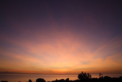 Scenic view of silhouette trees against sky during sunset