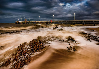 Scenic view of sea against cloudy sky