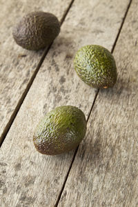 Close-up of avocados on table