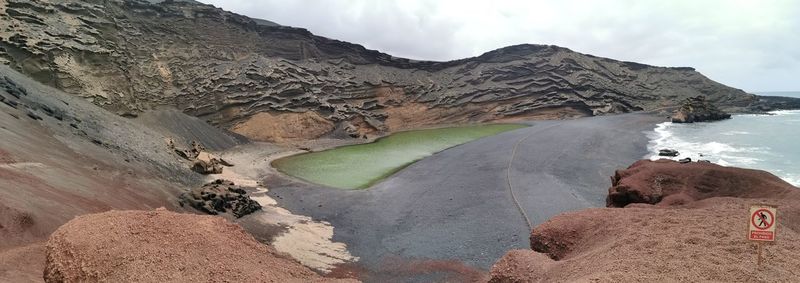 Panoramic view of rock formations against sky