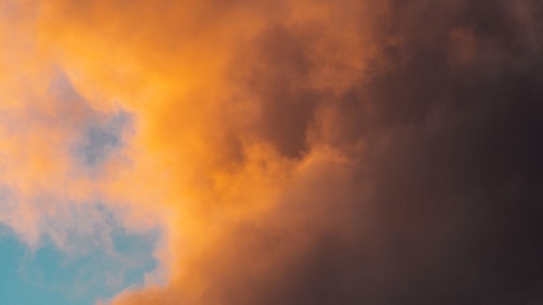 Low angle view of cloudy sky during sunset