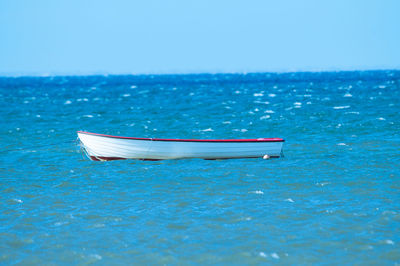 Boat in sea against sky