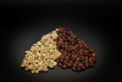 High angle view of coffee beans against black background