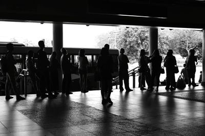 Group of people walking in row