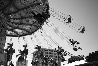 Low angle view of carousel against clear sky