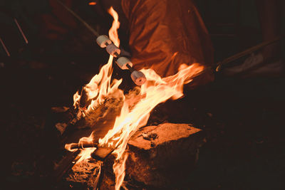 High angle view of fire on wood at night