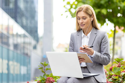 Portrait of young businesswoman using digital tablet